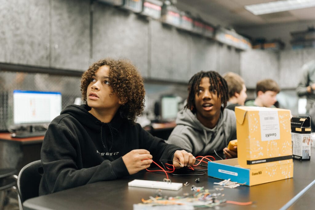 Students in the GO TEC program work with electrical wires. 